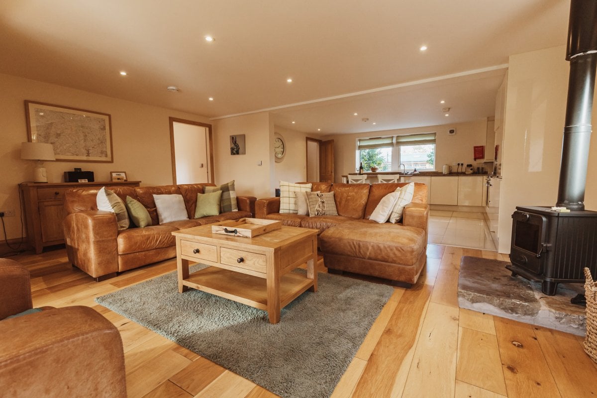 Waddow Cottage - open plan lounge with wood burner